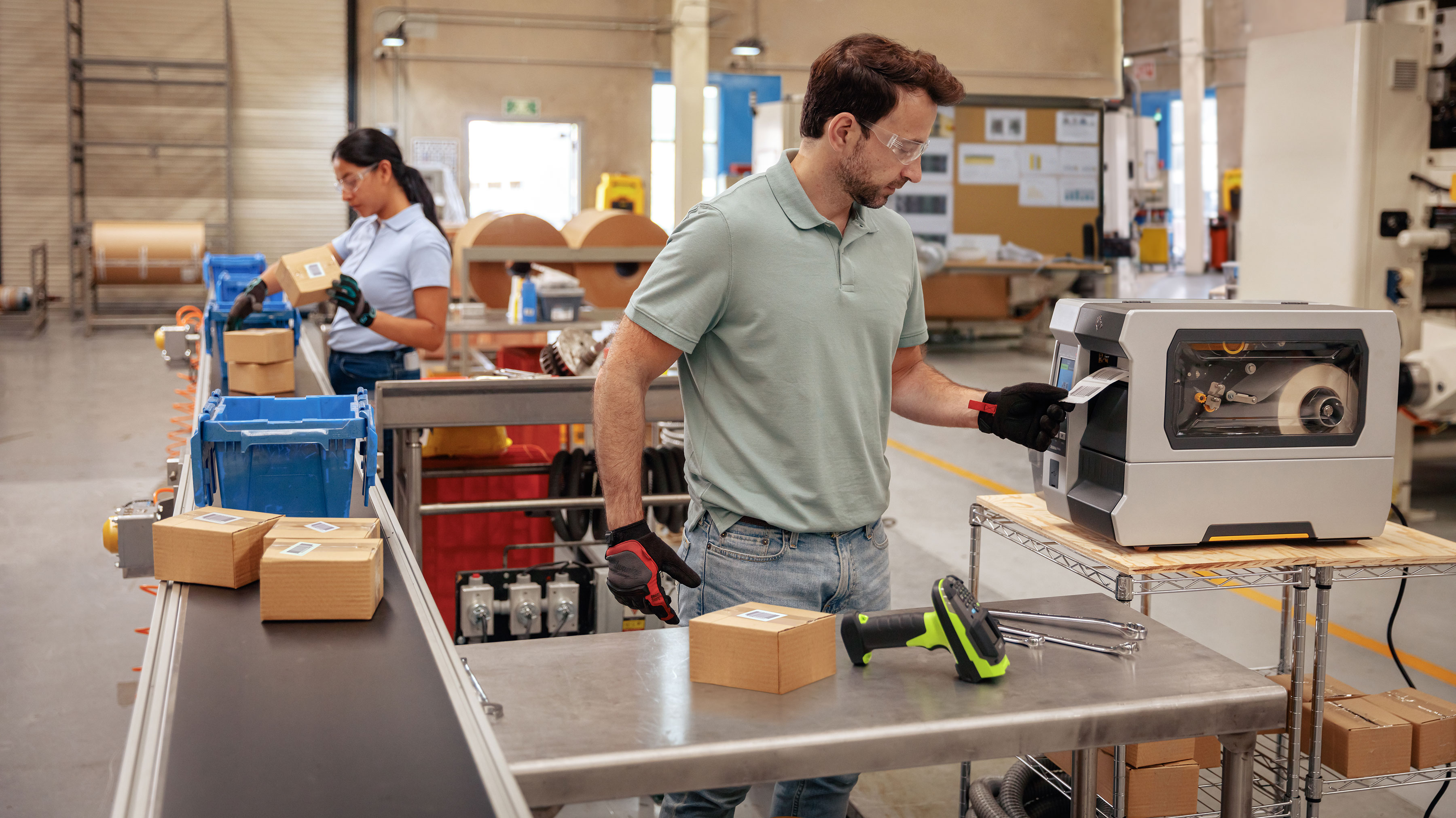 Worker uses a Zebra mobile printer attached to a belt strap to print labels and receipts in a warehouse hands free