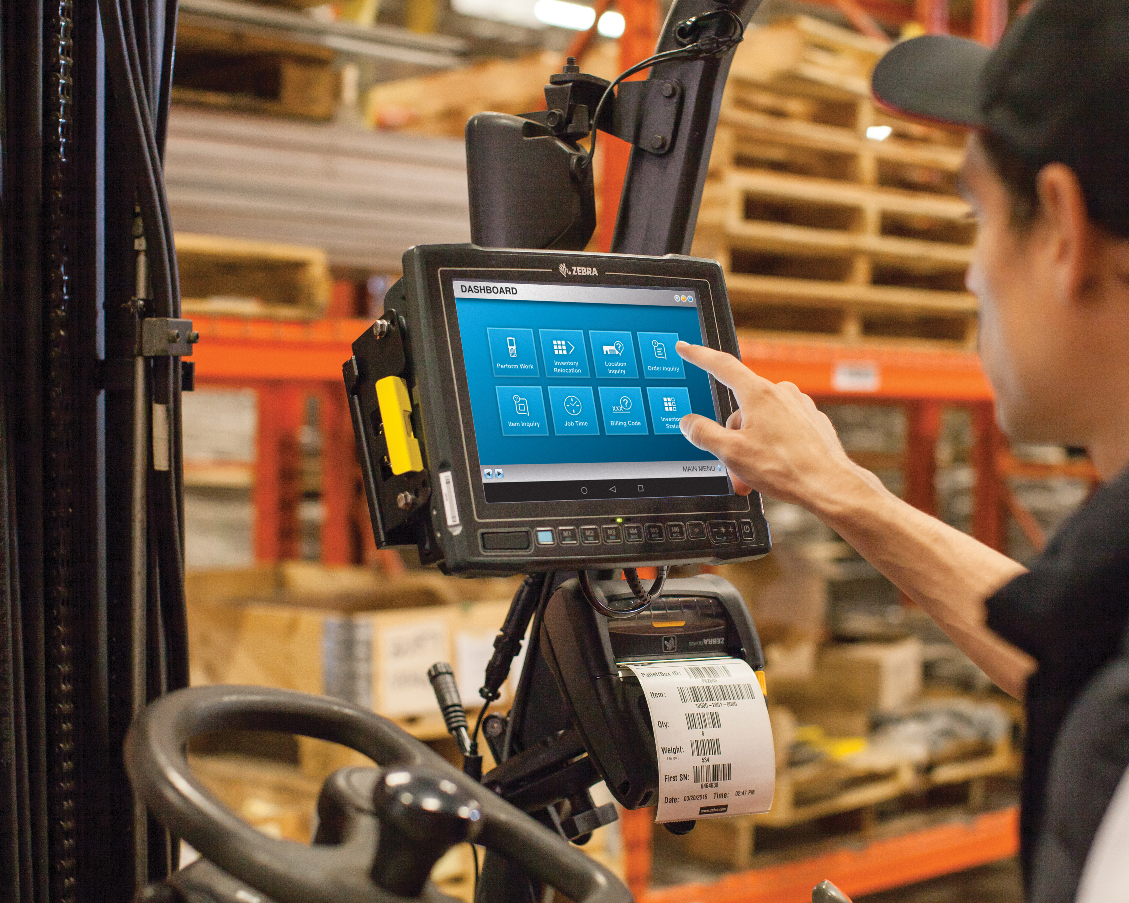 A Zebra vehicle-mounted computer installed on a forklift in a warehouse setting