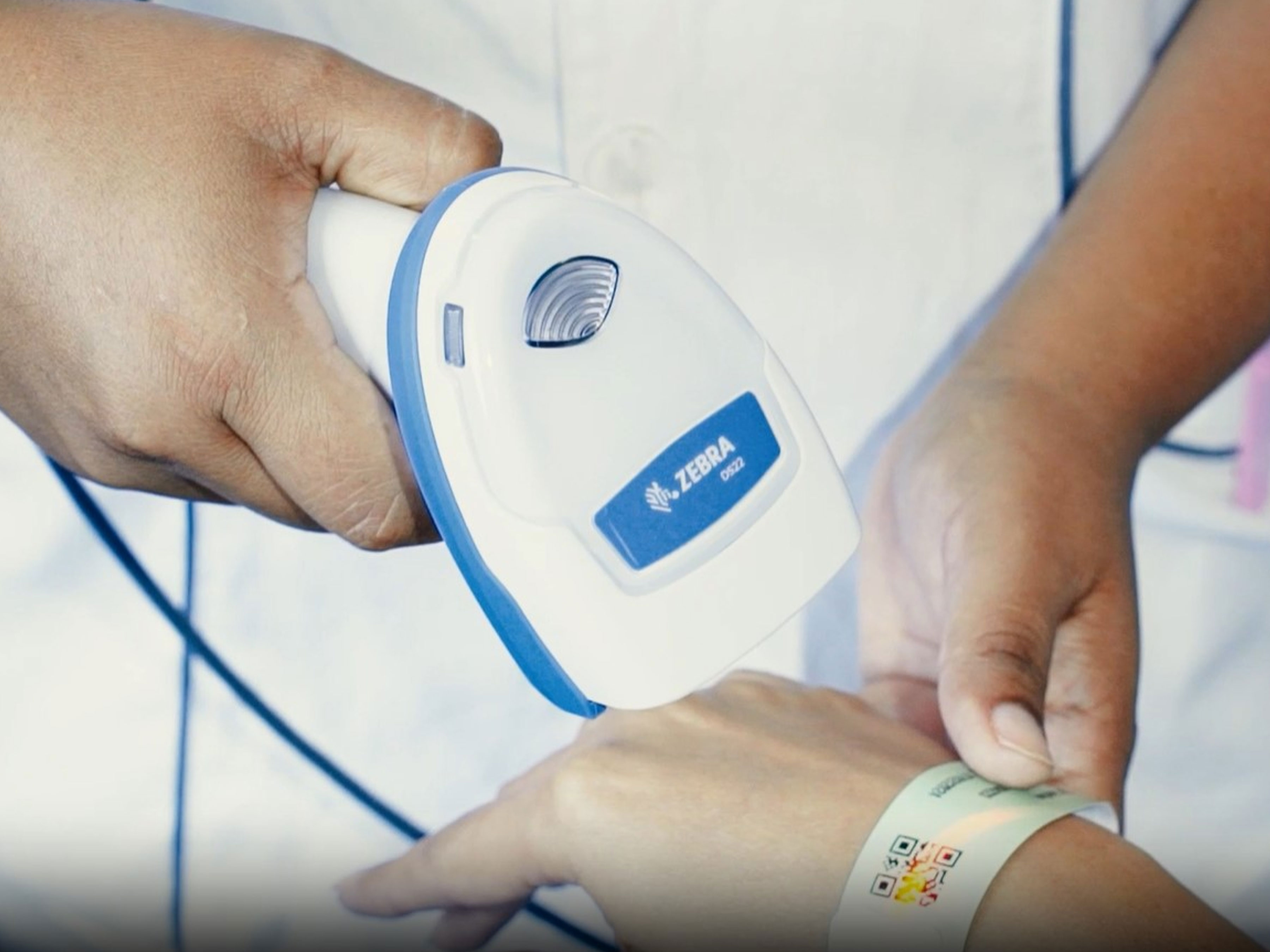 Zebra scanner scanning healthcare wristband on patient