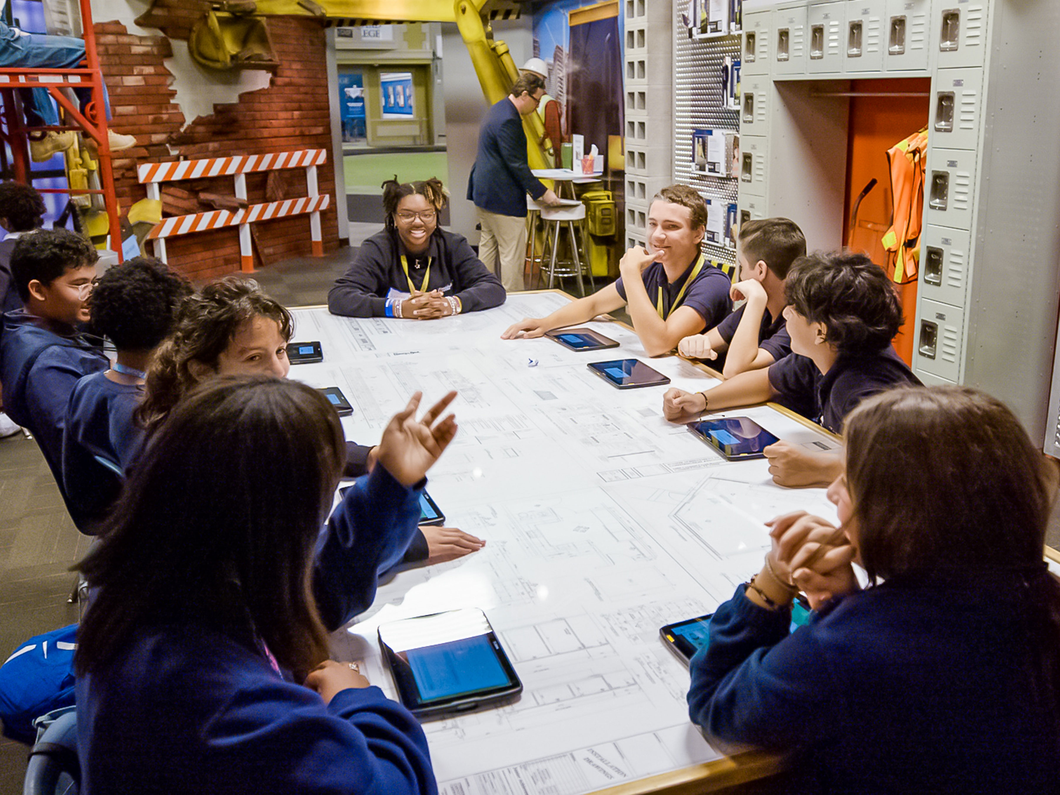 Group of students sitting at a table in a classrom