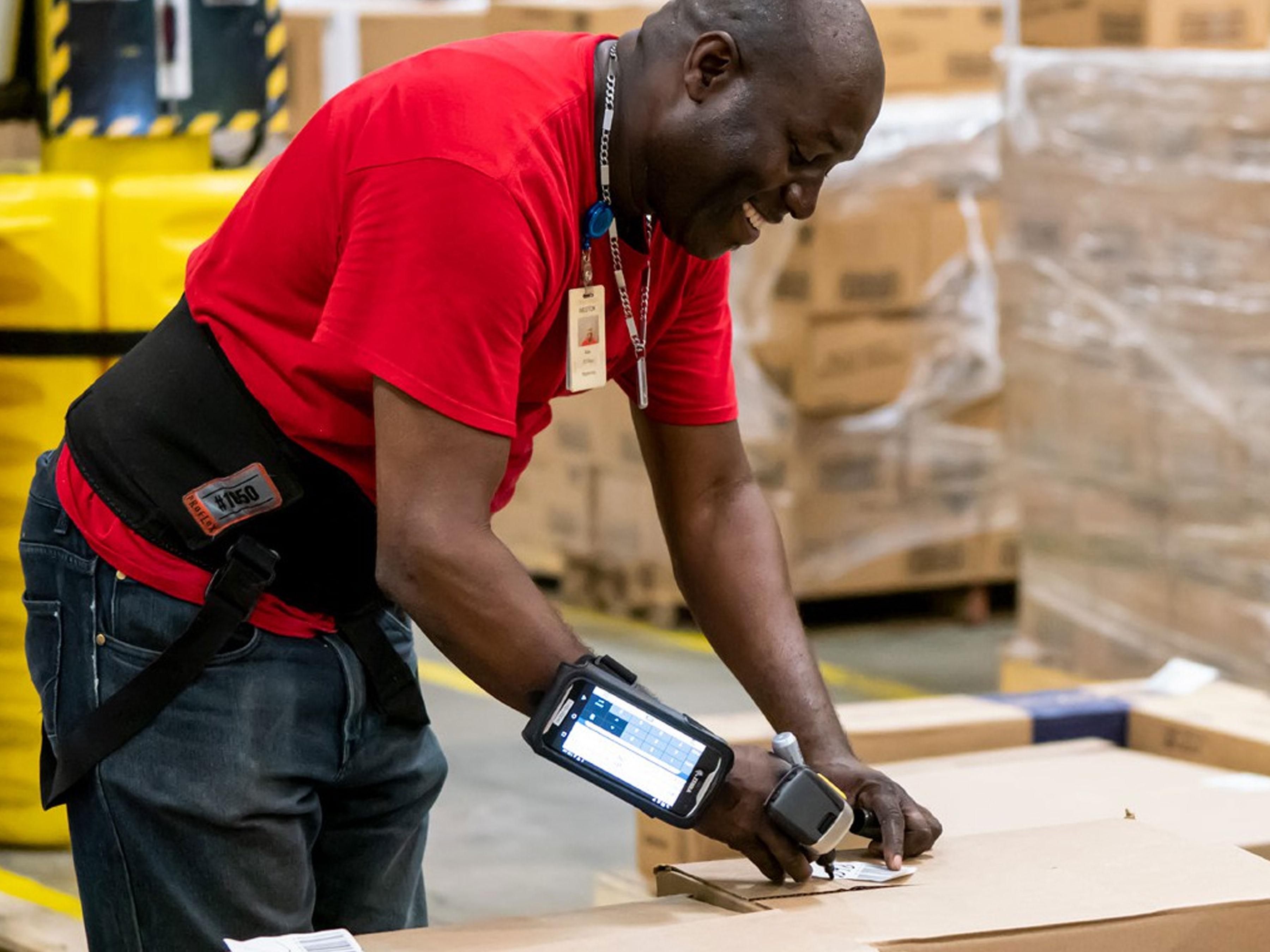 Office Depot worker scanning clothing with Zebra scanner