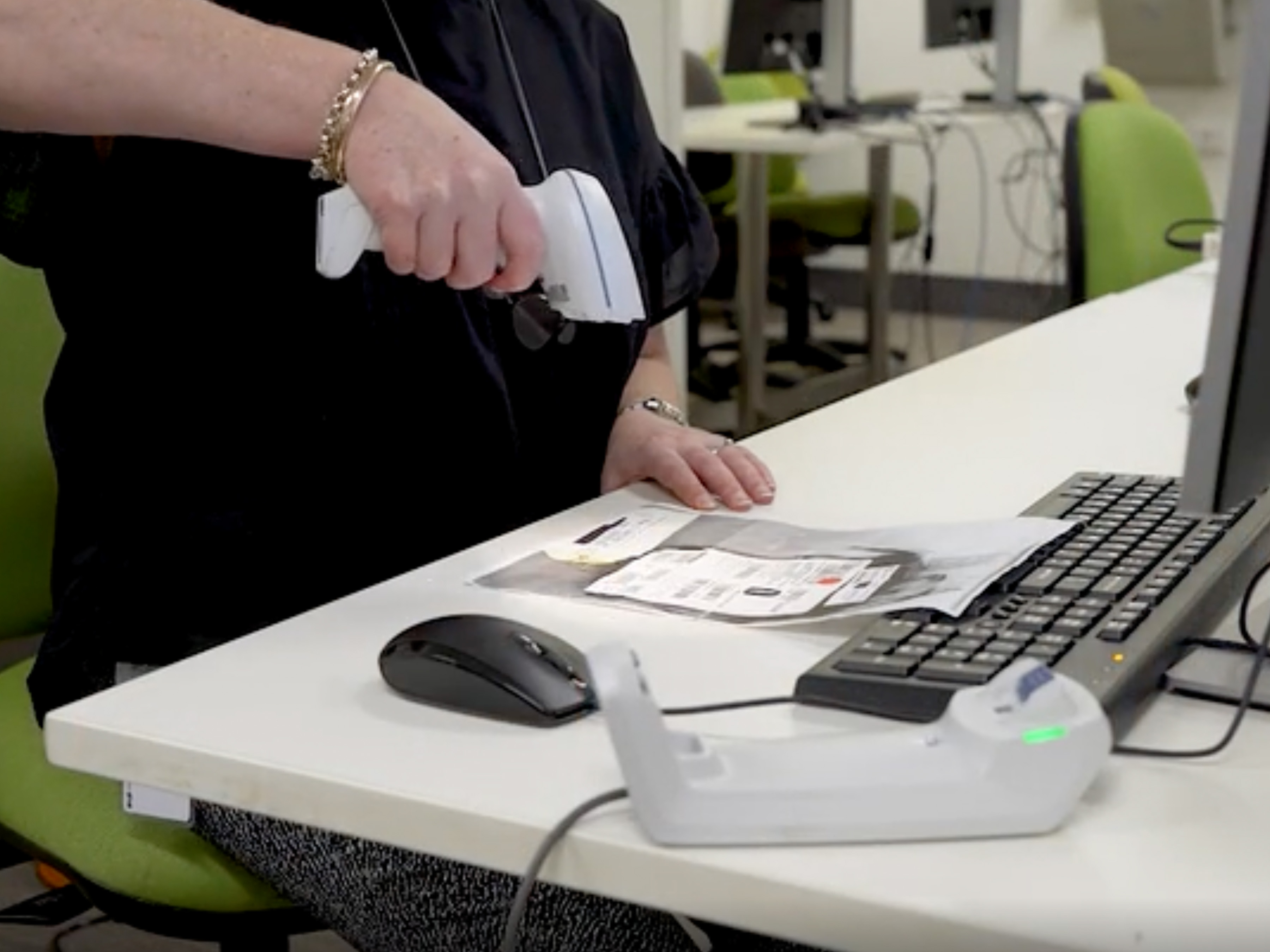 Healthcare worker using barcode scanner