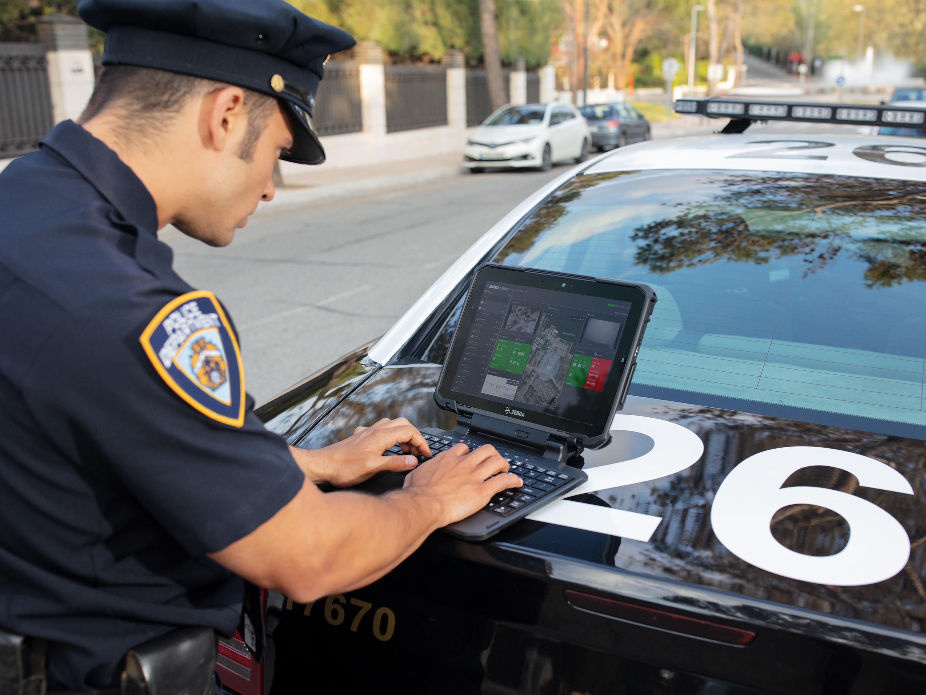 Police using an ET80/85 on top of a patrol car in the middle of the street