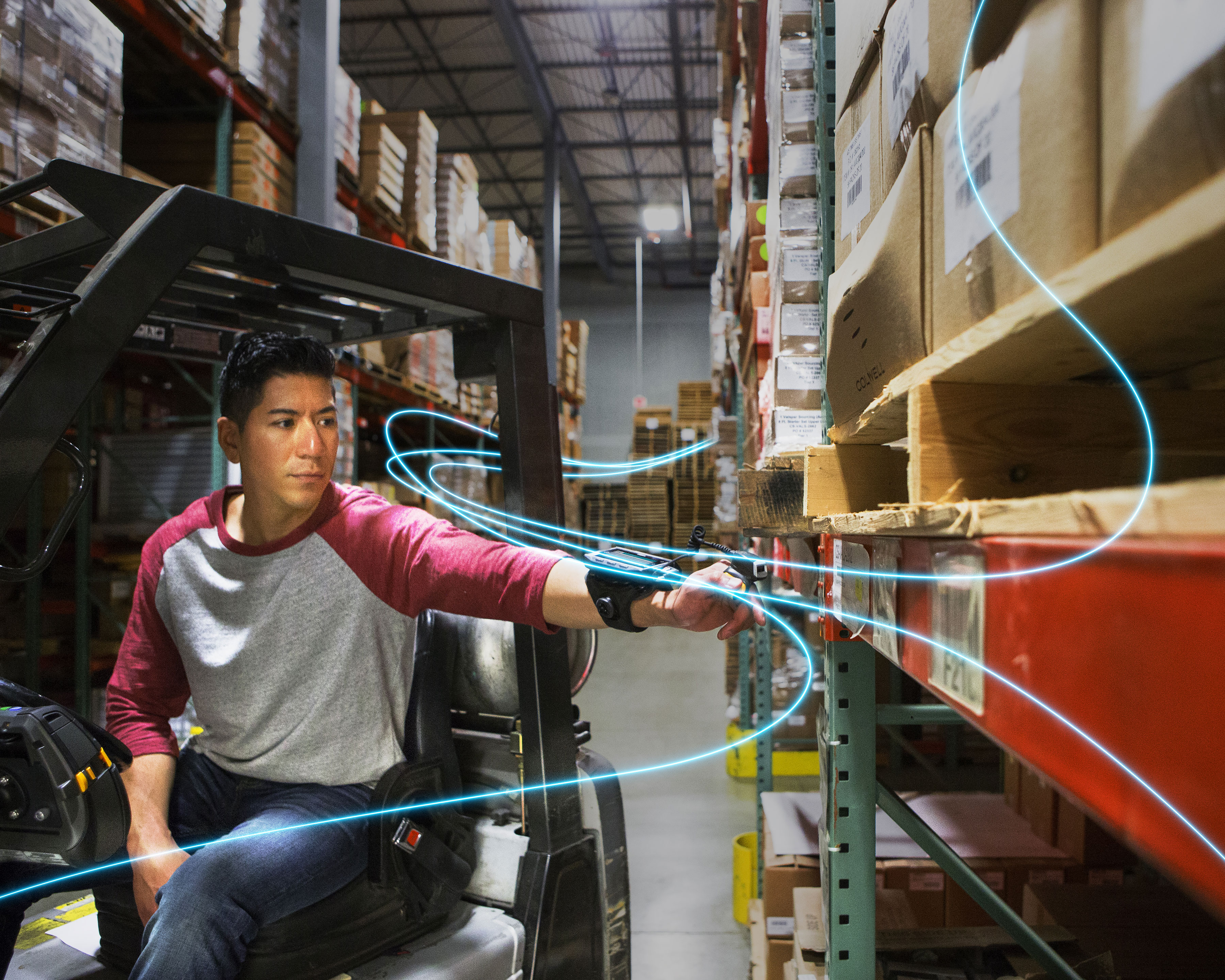 Warehouse worker uses Zebra RS4000 ring scanner to scan shelf barcodes while riding a forklift truck