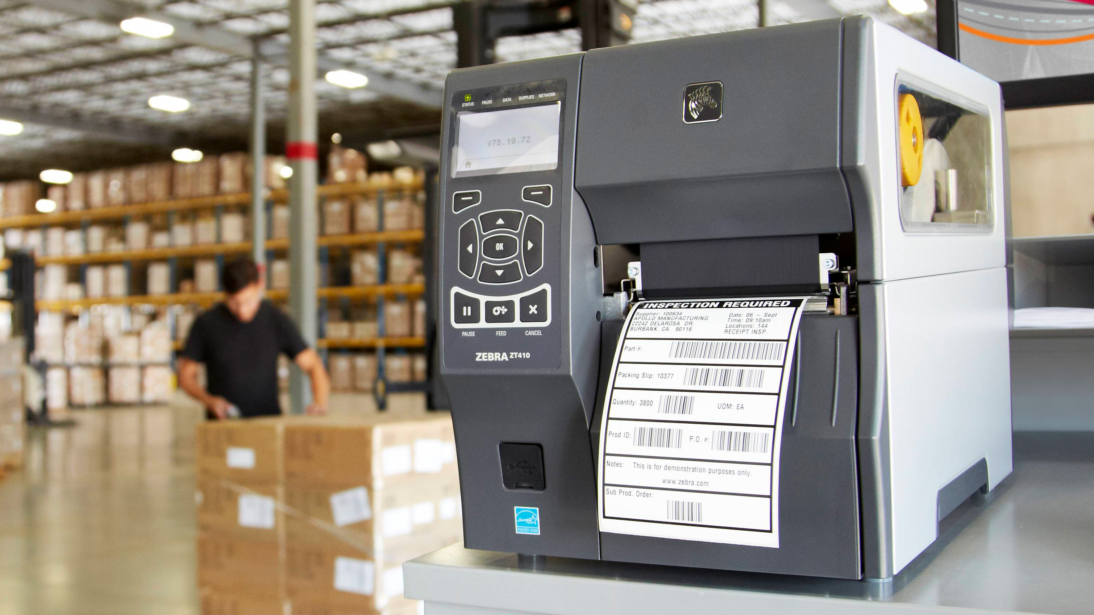 Zebra printer printing labels with barcodes.