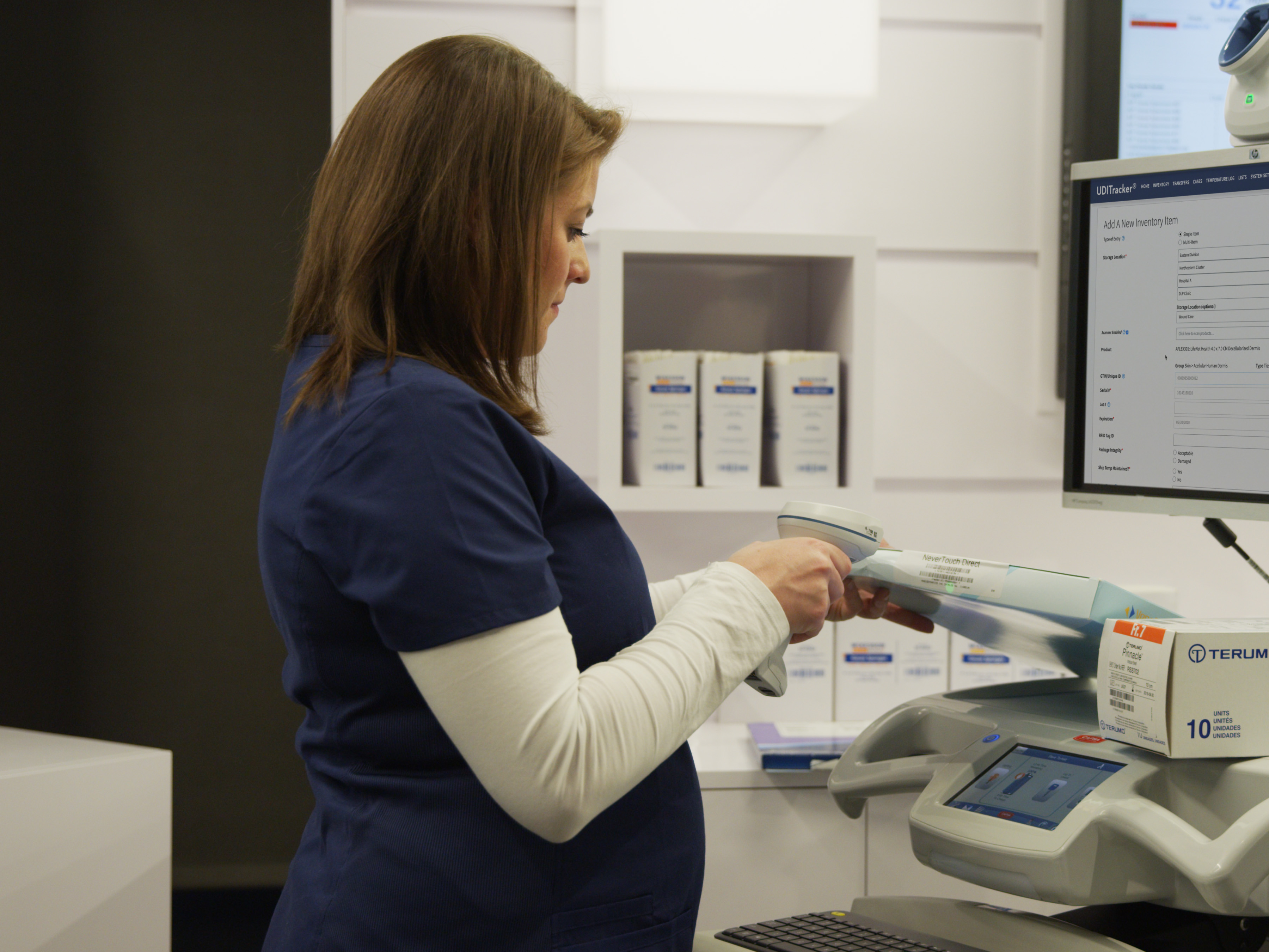 A healthcare worker scanning a UDI.